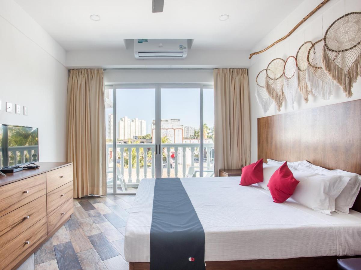 Capital O Cancun Ocean View, Cancún Esterno foto A bedroom at the hotel